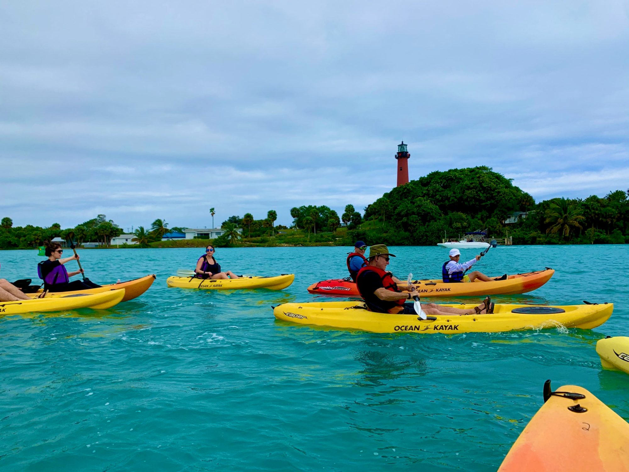 Lighthouse Group a group of people on a boat in the water