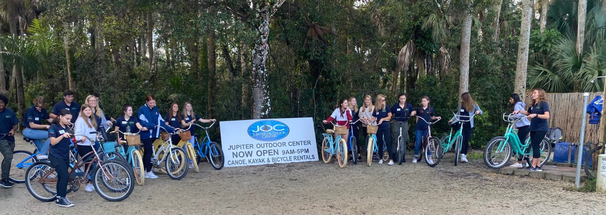 IMG_0561 a group of people riding on the back of a bicycle