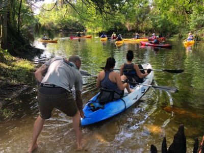 a group of people on a boat in the water
