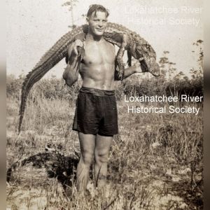 a man standing on top of a grass covered field