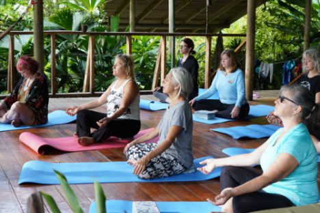 a group of people sitting at a picnic table