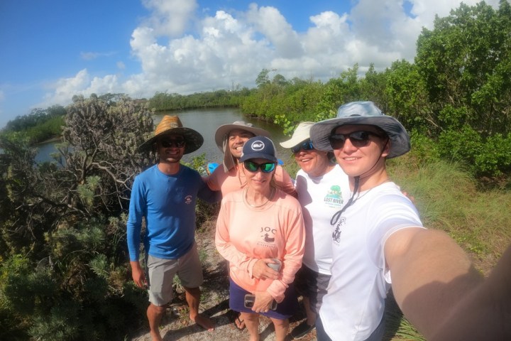 a couple of people that are standing in the grass