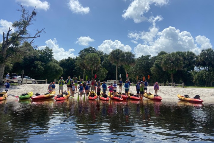 a group of people on a boat in the water