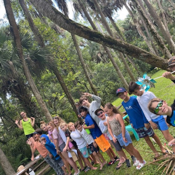 a group of people holding a kite