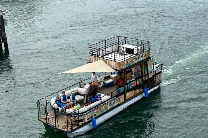 a boat is docked next to a body of water